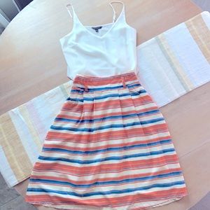 Knee length, pleated, striped skirt.